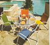 Picture of Telescope Gardenella Sling Patio Set Includes 4 Gardenella Chairs with a 42 Inch Round Glass Dining Table