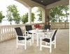 Telescope Leeward Patio Set Includes 4 Sling Arm Chairs and a 54 Inch Marine Grade Polymer Round Dining Table