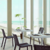 Netkat Stackable Polypropylene Patio Armless Cafe Chair -Lifestyle
