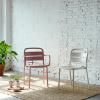 Como Stackable Polypropylene Patio Dining Armchair - Lifestyle2