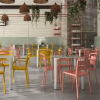 Como Stackable Polypropylene Patio Dining Armchair - Lifestyle