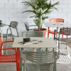 Toledo Air 27.6” Square Dining Patio Table with HPL Top and Painted Aluminum X Base - Lifestyle