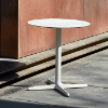 Toledo 27.6” Round Dining Patio Table with HPL Top and Painted Aluminum X Base - Lifestyle