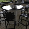 Coast Basketweave Vinyl Strap Armless Patio Bar Height Chair - Lifestyle