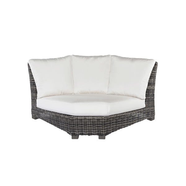 Dark woven wicker 90-degree curved corner sectional with white cushions.