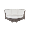 Woven resin wicker 90-degree corner sectional with white cushions.