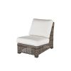 Woven wicker armless patio chair with white cushions in hickory finish.