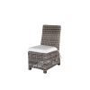 Woven wicker dining side chair with white cushion in hickory finish.