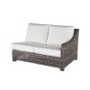 Woven wicker left arm loveseat with white cushions in hickory finish.