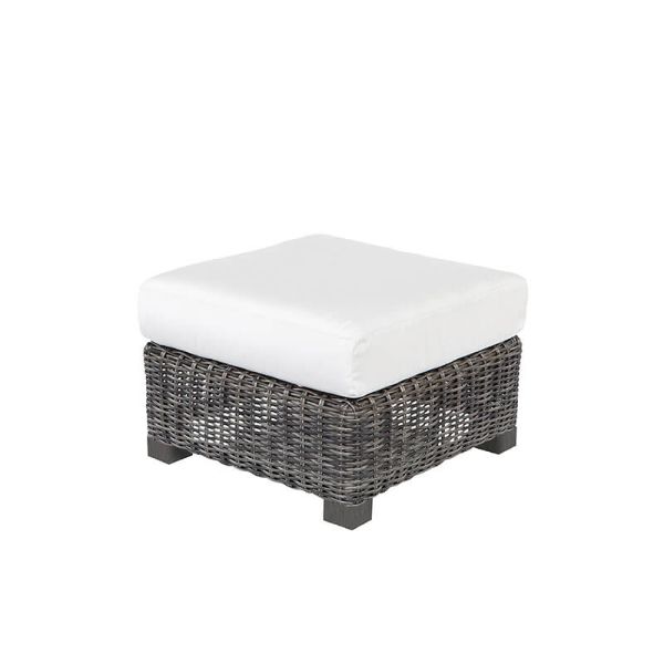 Woven wicker ottoman with white cushion in smoke finish.