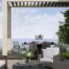 Outdoor patio dining with Cabana woven seat dining arm chairs and modern wicker lounge furniture by the ocean
