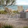 Outdoor patio firepit seating with Cabana woven high back club chairs in Barley and Bone finish overlooking ocean view