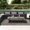 Contemporary Grande wicker padded 105-inch armless sofa sectional paired with a sleek coffee table on a poolside patio.