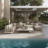 Grande wicker padded chaise lounge in Barley Flax by poolside with sectional set