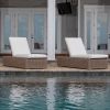 Laurent wicker cushion chaise lounges in Driftwood finish with white cushions beside a pool.