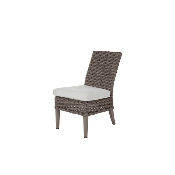 Laurent wicker cushion dining side chair in Driftwood finish with white seat cushion for outdoor dining spaces.