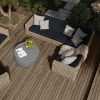 Mia Woven Cushion Sectional Patio Set in Barley Finish arranged around Round Fire Pit Table