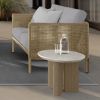 Orleans Woven Cushion Patio Loveseat in Barley Finish with Gray Cushions Beside Round Side Table
