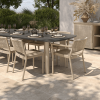 Outdoor dining table set with Orleans woven side chairs in Barley Flax finish.