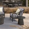 Palazzo Onyx deep seating club chair with gray cushions beside a modern round end table.