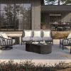 Outdoor lounge with Palazzo deep seating sofa in Onyx finish, paired with lounge chairs and modern coffee table.