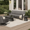 Outdoor patio setup featuring Siena wicker patio sofa in fog smoke with coffee table and swivel chair.