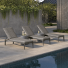 Poolside setup with multiple Siena wicker chaise lounges in Fog Smoke finish.