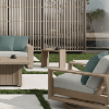 Bari Side Table in Beige with Cushioned Patio Seating in Backyard Space