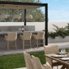 Siena wicker counter height stools arranged at outdoor patio bar in Barley Flax