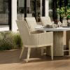 Siena Wicker Patio Dining Chairs in Barley Flax Finish Around Outdoor Dining Table