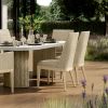 Siena Wicker Patio Dining Side Chairs in Barley Flax Finish Around Outdoor Dining Table