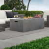 Modern Bellino rectangular fire pit table lit with flames, displayed with outdoor wicker seating.