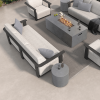 Bellino 18″ round concrete side table next to outdoor sofa and fire pit on modern patio.