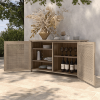 Orleans woven patio sideboard open with shelves displaying dinnerware and wine bottles, barley flax finish.