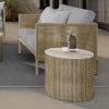 Hampton round side table with alabaster top paired with outdoor wicker sofa set on a patio