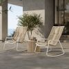 Hampton patio side table with alabaster top styled with woven lounge chairs on outdoor terrace