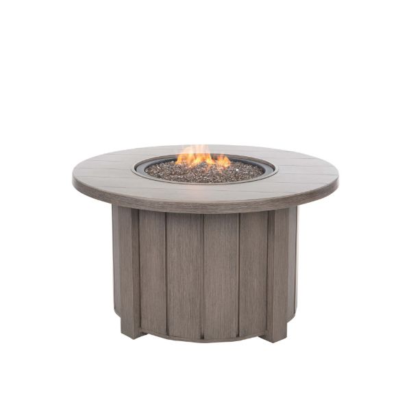 Trevi 42 inch round fire pit patio table in hickory finish with flames lit and glass rock media