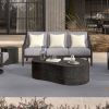 Contemporary outdoor seating with Tahoe slate coffee table centerpiece by sofa and lounge chairs