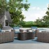Tahoe 54" x 35" Slate Patio Fire Pit Table in luxury outdoor seating area with flames
