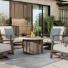 Trevi Pompano round fire pit patio table with light wood base and modern lounge chairs in outdoor seating area
