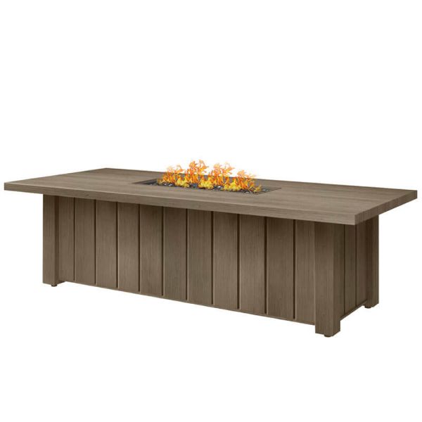 XL Trevi rectangular fire pit patio table in hickory finish with fire lit.