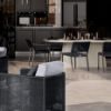 Modern Outdoor Dining Area Featuring Pompano Rectangular Patio Table and Black Chairs