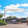 Eclipse 11 foot octagonal cantilever umbrella shading poolside chaise lounge on luxury hotel and resort patio deck