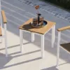 Main Street 18 inch square side table in a poolside seating area with drinks and decorative tray