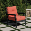 Blue Ridge deep seating cushion patio chair with black HDPE frame and Sunbrella orange cushions