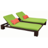 Java Chocolate wicker double chaise lounge with green cushions and orange accent pillows for commercial outdoor poolside seating
