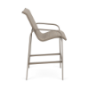 Side view of Horizon sling commercial patio bar chair with Satin Amber aluminum frame and Cane Weaver Pacific sling seat and back