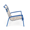 Side view of Skyline stackable vinyl strap commercial patio sand chair with Marina blue aluminum frame and Off White vinyl straps