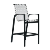 Skyline cross-weave commercial patio bar chair with black aluminum frame, white woven vinyl straps, armrests, and integrated footrest